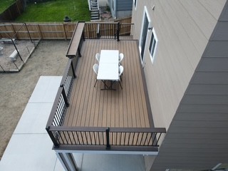 Overhead view of finished composite deck with dining set