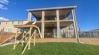 Full rear house view showing upper and lower deck