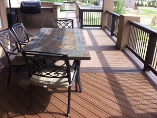 Covered deck dining area with finished flooring