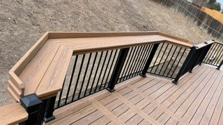 Corner bench and black railing close-up