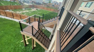 Elevated stair run with black railing system